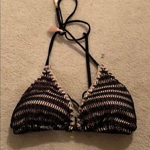 -Black and nude color bikini top.